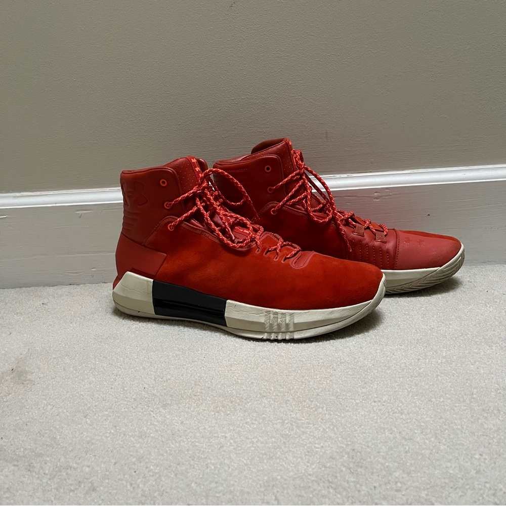 Red high top Under Armour basketball shoes